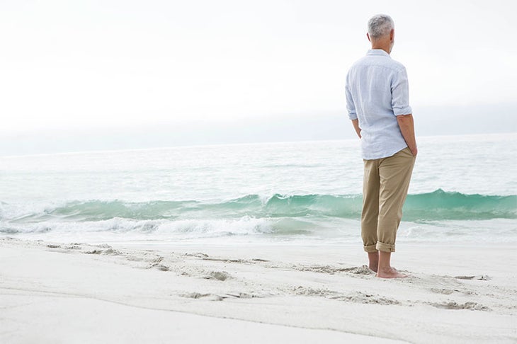 man-facing-ocean